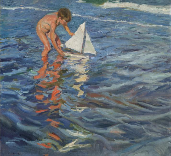 Schilderij El Balandrito van Sorolla met een jongen die in de zee staat zonder kleding aan met een wit zeilbootje in zijn handen.